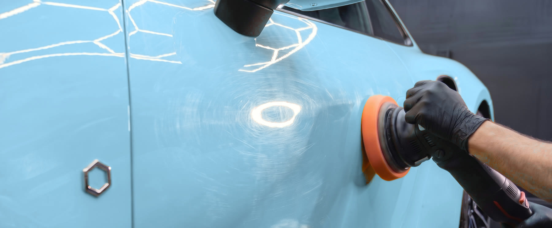 Door before paint correction, covered in swirl marks